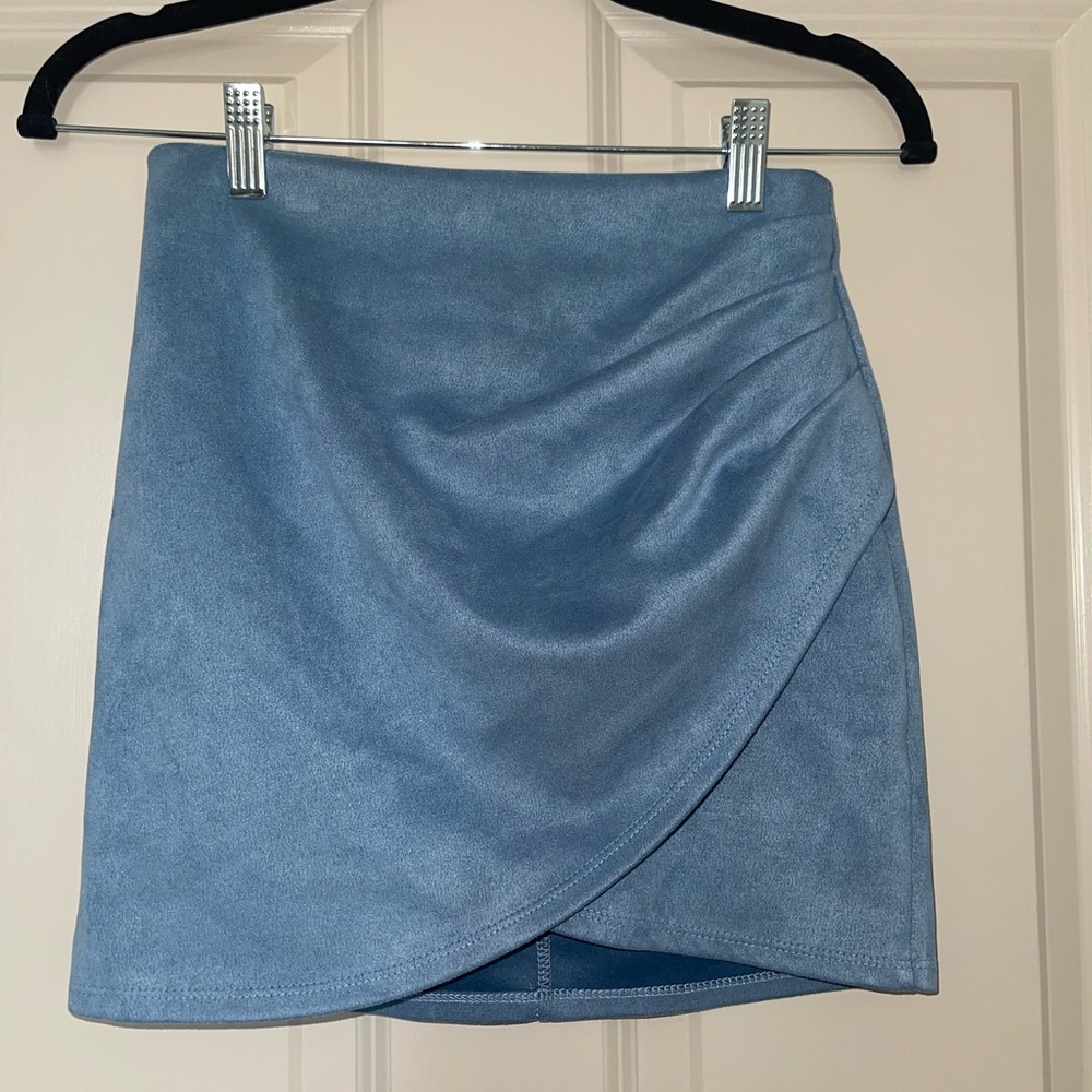 Mildly worn blue suede mini skirt in a size small. Tag was mistakenly removed